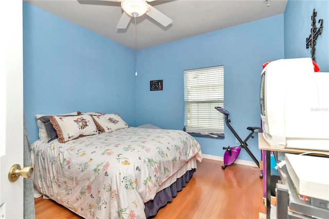 bedroom featuring ceiling fan and hardwood / wood-style flooring