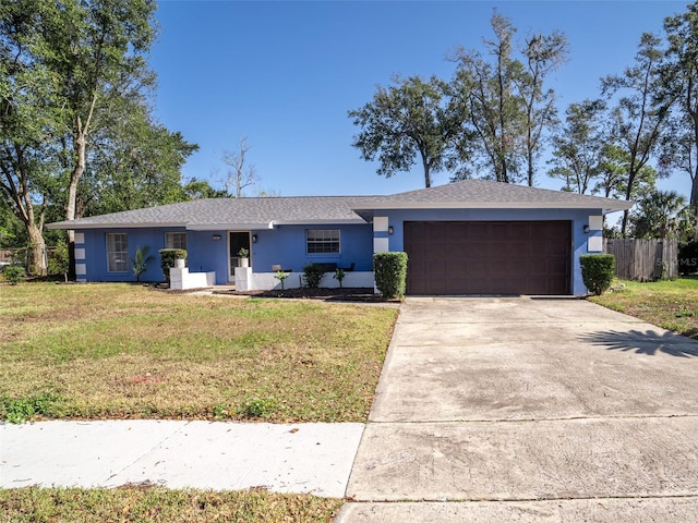 single story home with a front lawn and a garage