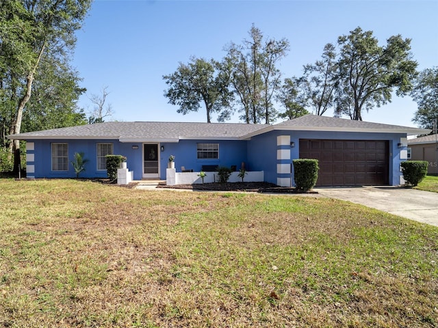 single story home with a front lawn and a garage