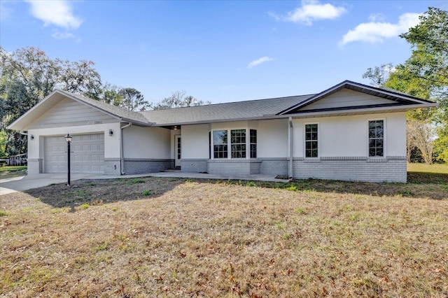 ranch-style home with a front yard and a garage