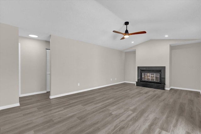 unfurnished living room featuring ceiling fan, lofted ceiling, and wood-type flooring