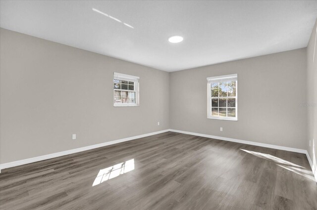 spare room featuring dark hardwood / wood-style floors