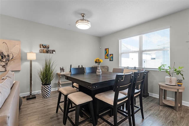 dining room with dark hardwood / wood-style floors