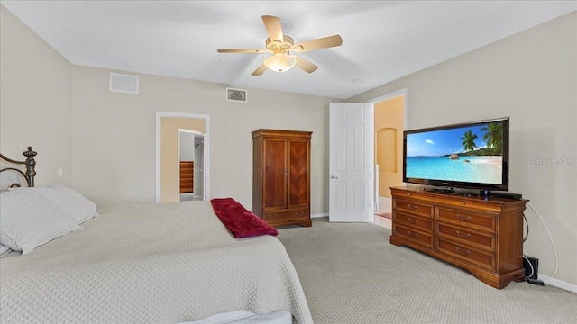 bedroom with ceiling fan and light colored carpet