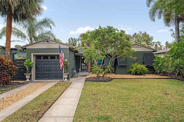 view of front of house featuring a garage and a front yard