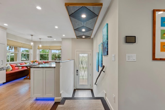 foyer with light wood-type flooring