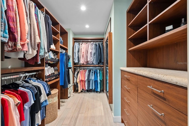 walk in closet featuring light wood-type flooring