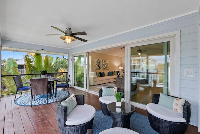 interior space with ceiling fan and outdoor lounge area