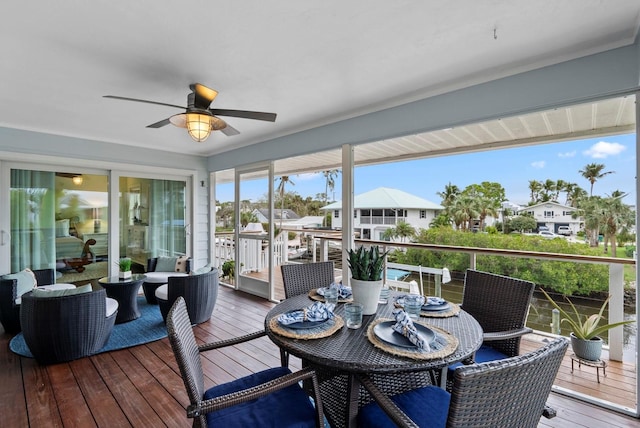 sunroom / solarium featuring ceiling fan