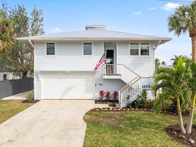 view of front of home with a garage and a front yard