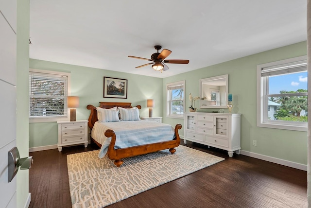 bedroom with ceiling fan and dark wood-type flooring