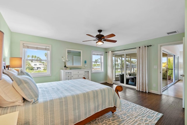 bedroom with access to exterior, ceiling fan, and dark hardwood / wood-style flooring