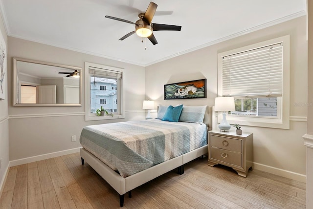 bedroom with ceiling fan, light hardwood / wood-style flooring, and crown molding