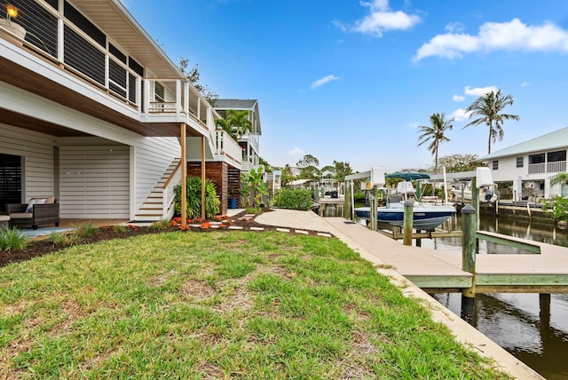 exterior space with a boat dock and a water view