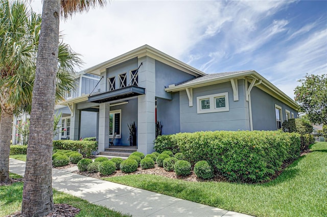 view of front of home with a front yard