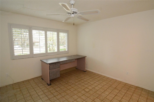 unfurnished office featuring ceiling fan