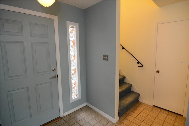 foyer featuring light tile patterned floors