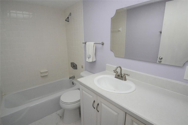 full bathroom with toilet, vanity, and tiled shower / bath combo