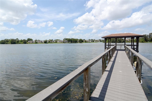 view of dock with a water view and a gazebo