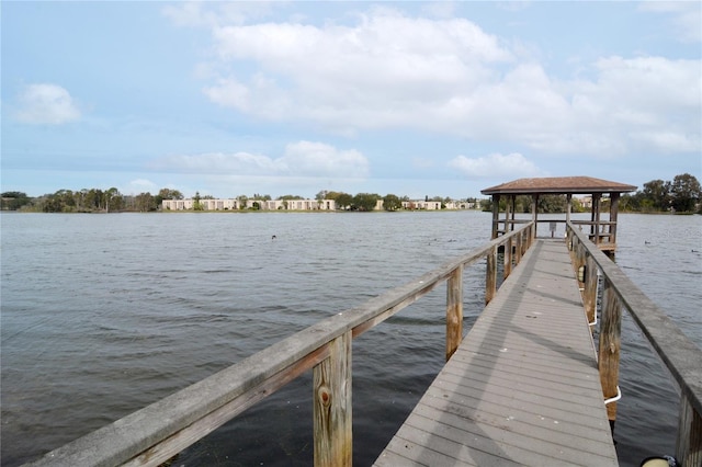 dock area with a water view and a gazebo