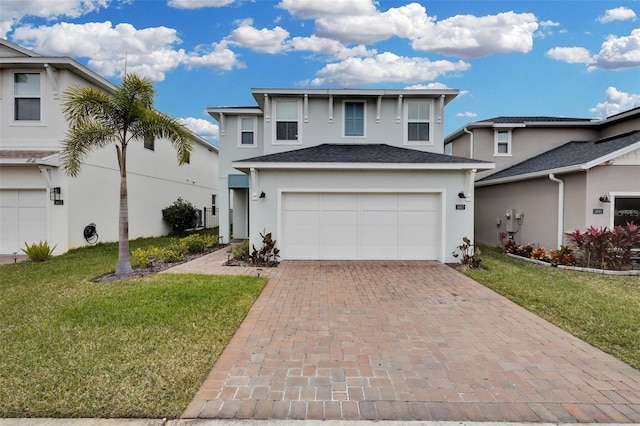 view of front of house with a garage and a front yard