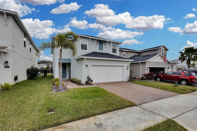 view of front of house featuring a front lawn and a garage