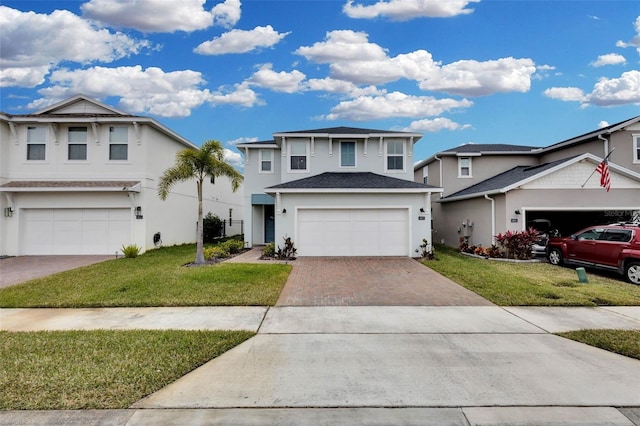 view of front of house with a garage and a front yard