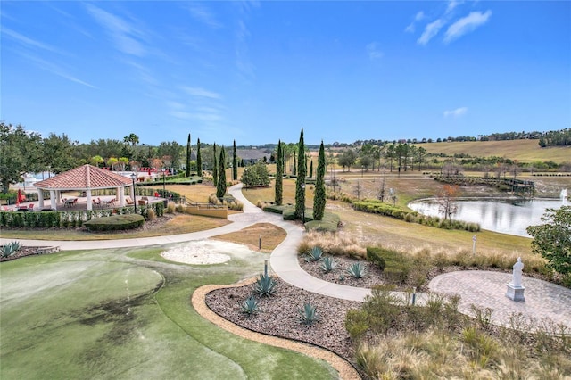 view of property's community featuring a gazebo and a water view