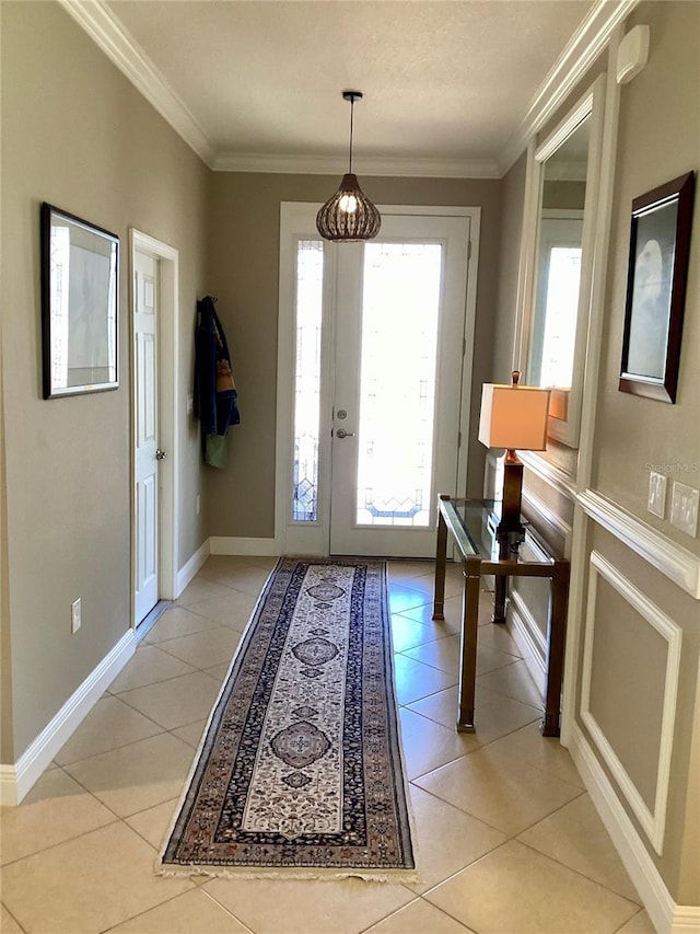 doorway to outside featuring light tile patterned flooring and crown molding