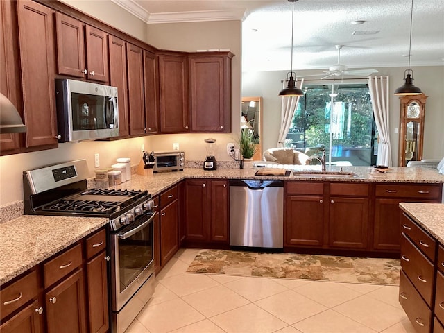 kitchen featuring light tile patterned floors, appliances with stainless steel finishes, pendant lighting, light stone counters, and sink