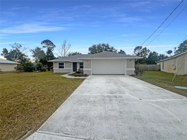 single story home featuring a garage and a front lawn