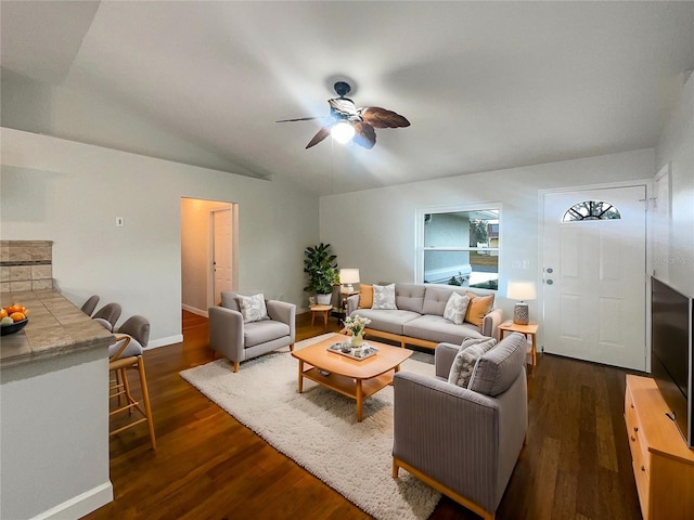 living room featuring ceiling fan, dark hardwood / wood-style flooring, and lofted ceiling