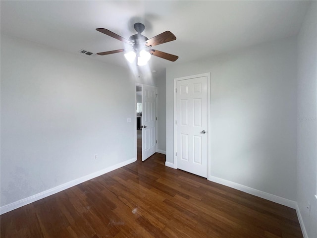 unfurnished bedroom with dark wood-type flooring and ceiling fan