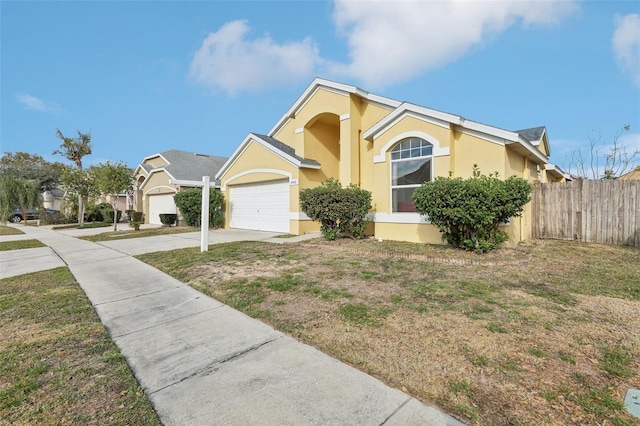 view of front facade with a garage and a front yard