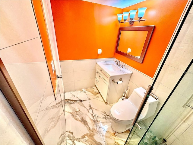 bathroom featuring toilet, vanity, tile walls, and a shower