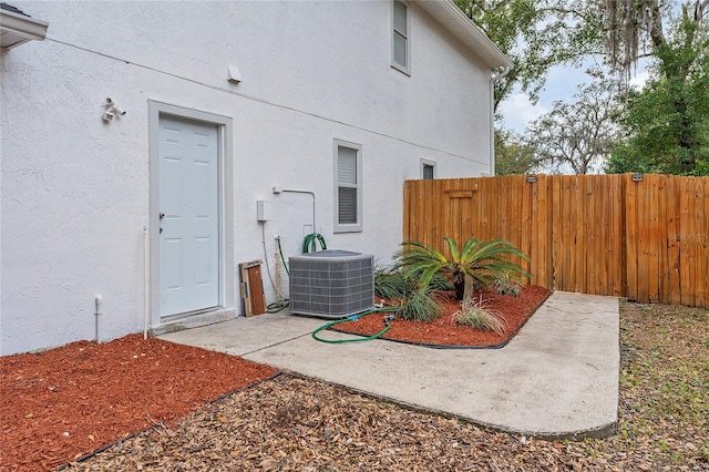 exterior space featuring a patio and central AC