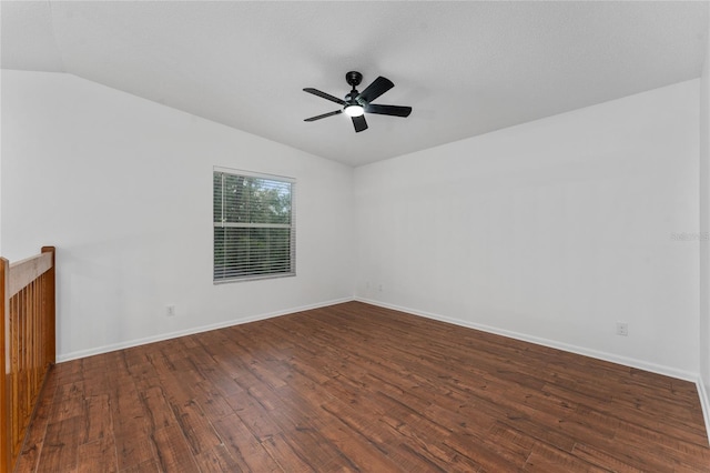 spare room with vaulted ceiling, ceiling fan, and dark hardwood / wood-style flooring