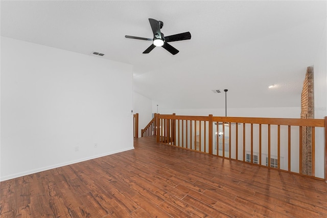 unfurnished room with ceiling fan, lofted ceiling, and hardwood / wood-style floors