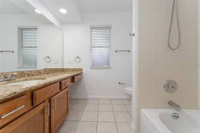 full bathroom featuring toilet, vanity, tile patterned flooring, and tiled shower / bath combo