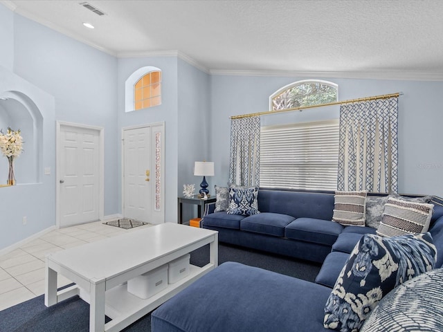 tiled living room featuring a textured ceiling and crown molding