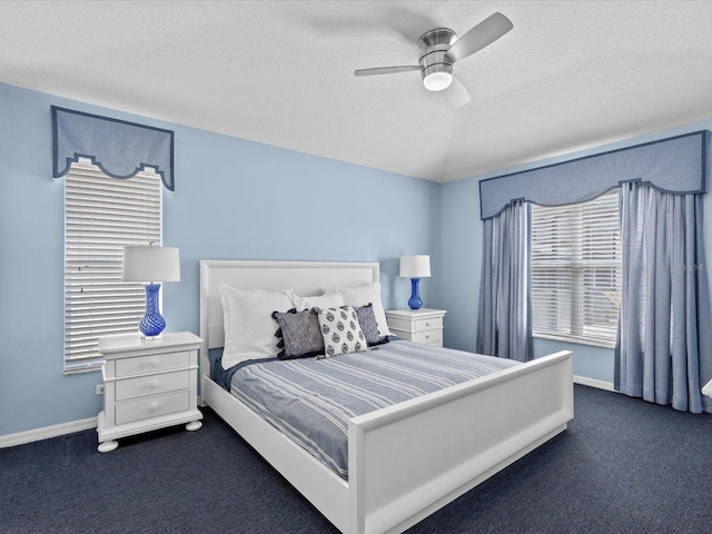 carpeted bedroom with ceiling fan, a textured ceiling, and lofted ceiling