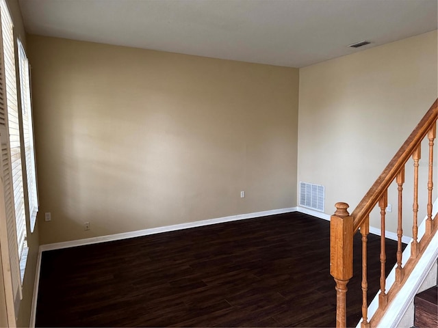 unfurnished room featuring dark hardwood / wood-style floors