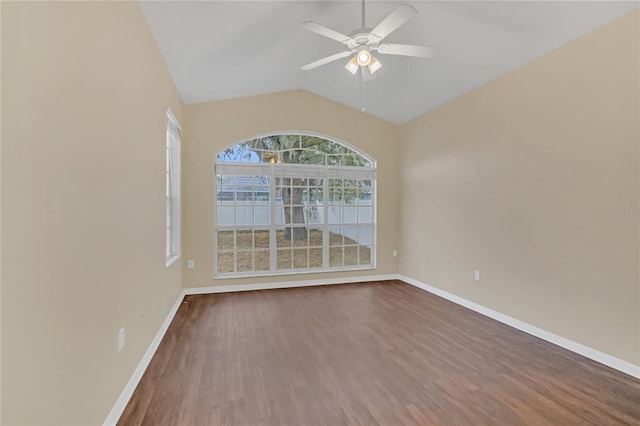 spare room featuring ceiling fan, wood-type flooring, and vaulted ceiling