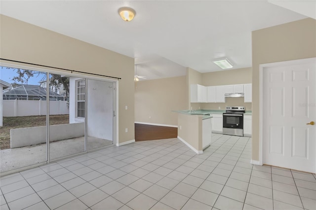 kitchen with white cabinets, light tile patterned floors, ceiling fan, and electric stove