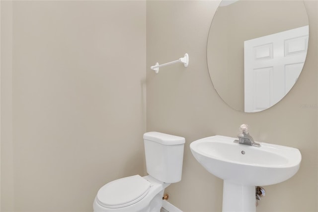 bathroom featuring sink and toilet