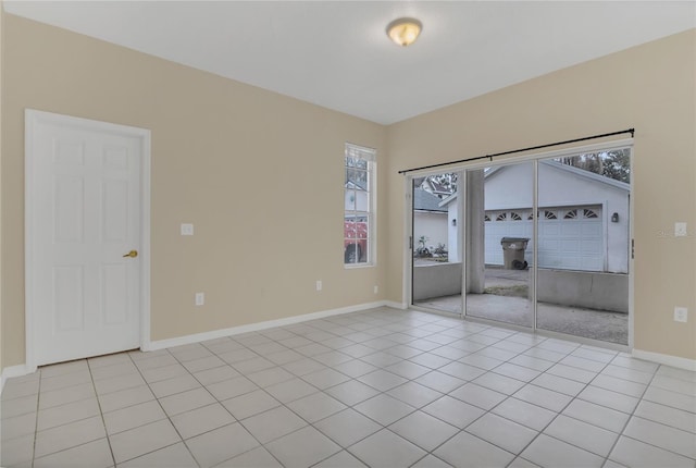 tiled empty room with a wealth of natural light