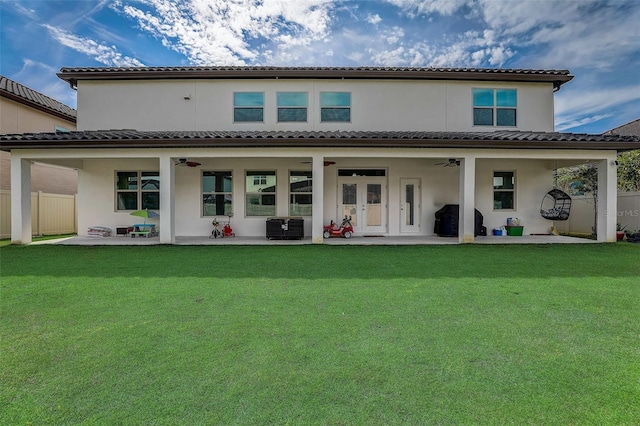 back of house with ceiling fan, central AC unit, a patio area, and a lawn