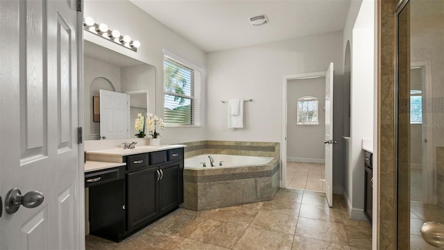 bathroom with vanity, tile patterned flooring, and plenty of natural light