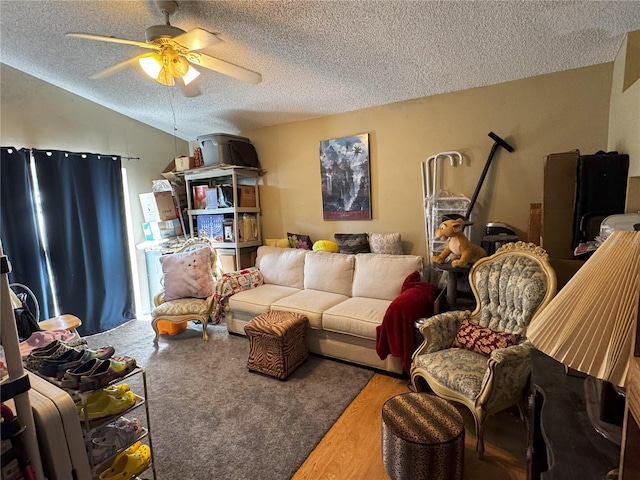 living room featuring a textured ceiling, ceiling fan, lofted ceiling, and hardwood / wood-style flooring