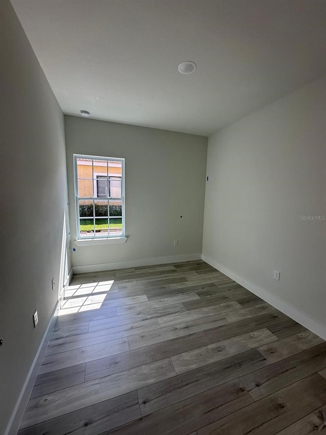 spare room featuring light hardwood / wood-style flooring